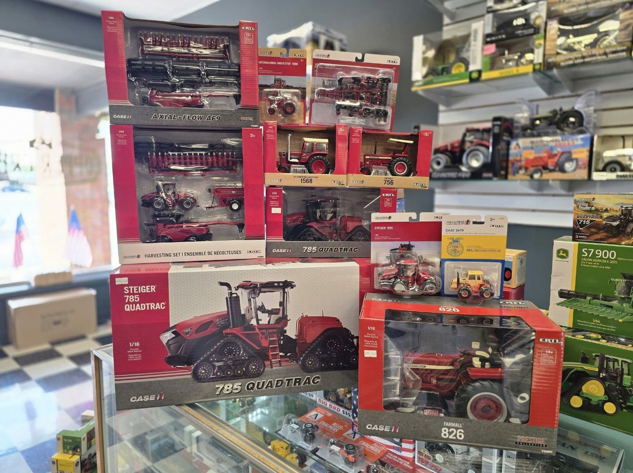 Case IH and John Deere tractors on the shelf