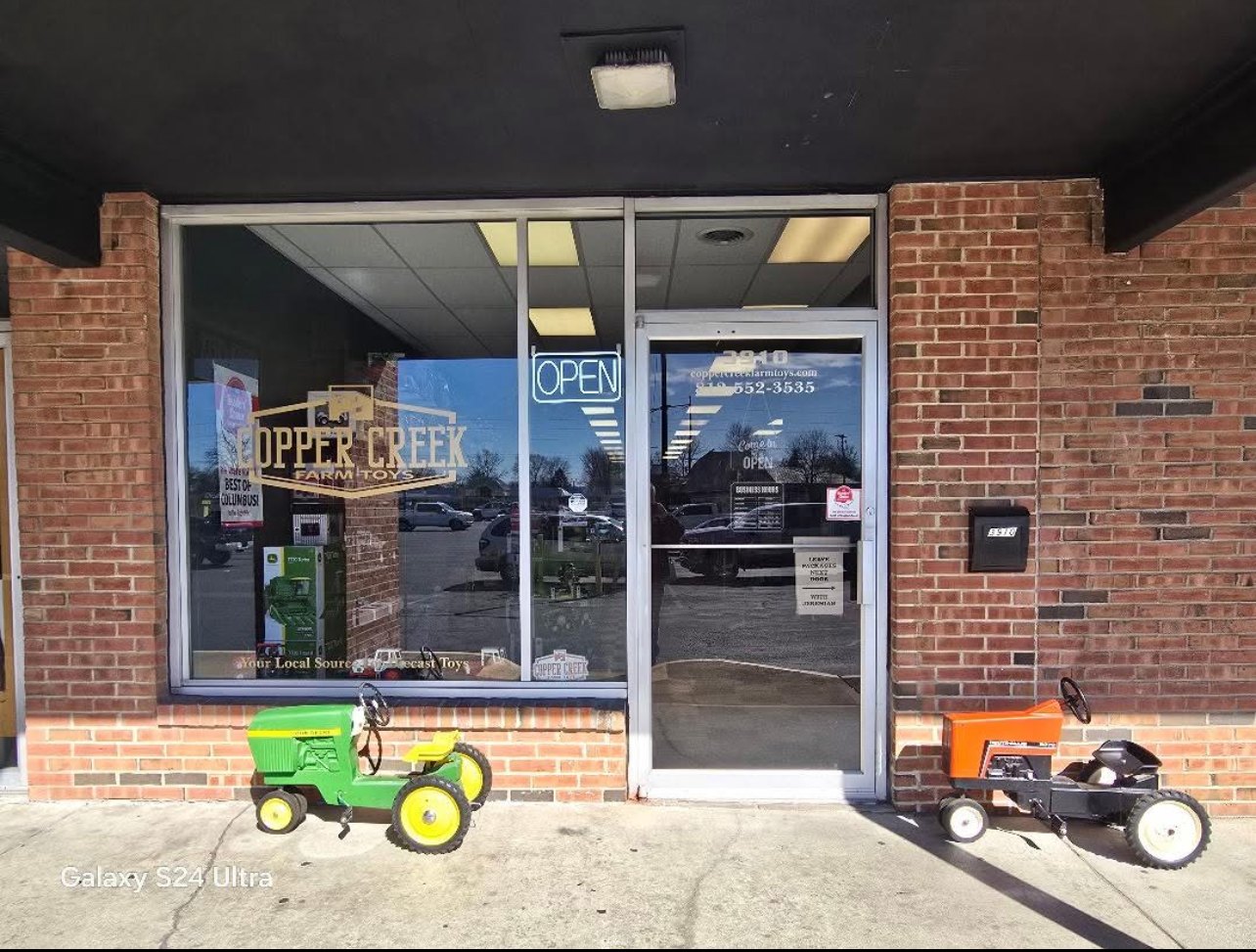 Pedal tractors outside the store